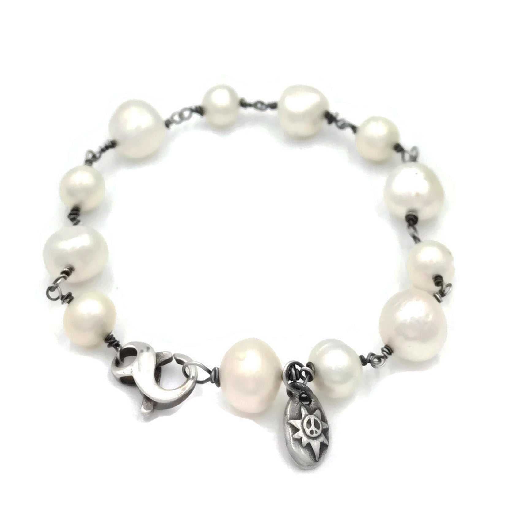 Pearl with peace sign bracelet